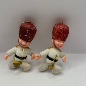Two vintage Christmas trombone player ornaments
